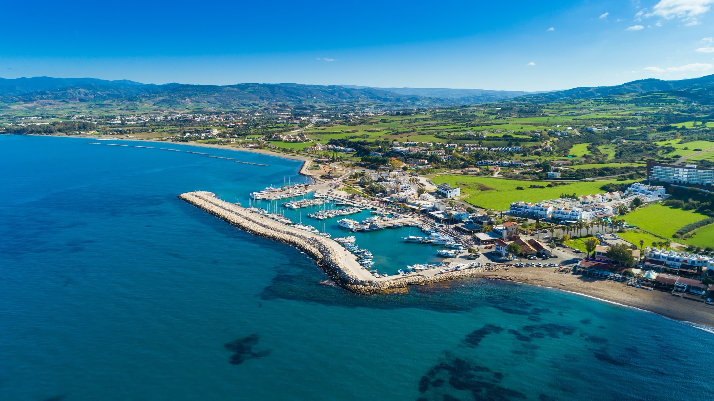Cyprus coastline with harbour and mountains